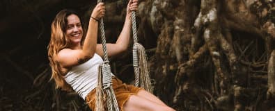 woman swinging by the Sok river